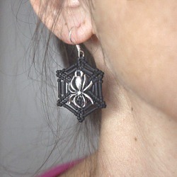 Halloween Spiders Web Earrings being worn